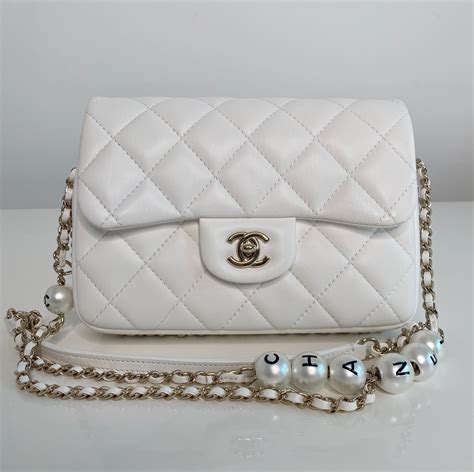 chanel pearl logo strap flap bag|Chanel vintage flap bag.